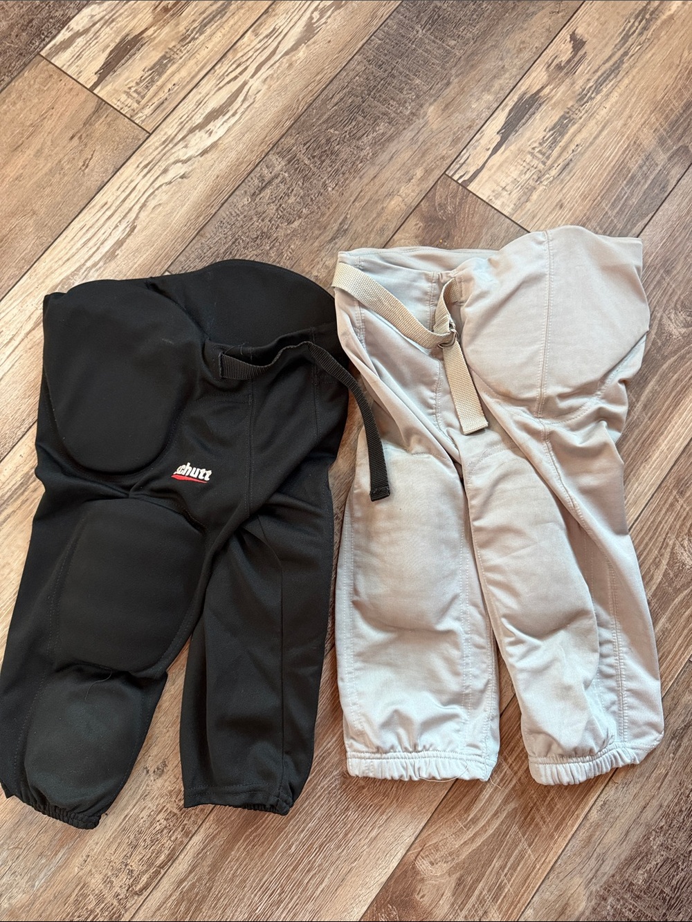 Youth large/xlarge 2 pair Padded Football pants - Black and grey